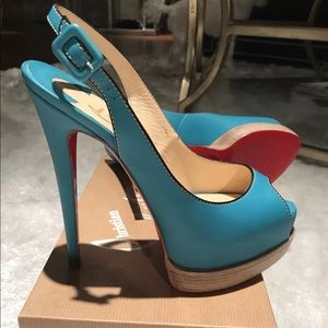 Christian Louboutin teal pumps